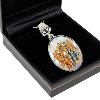 A pendant with a religious icon is displayed in a black box.