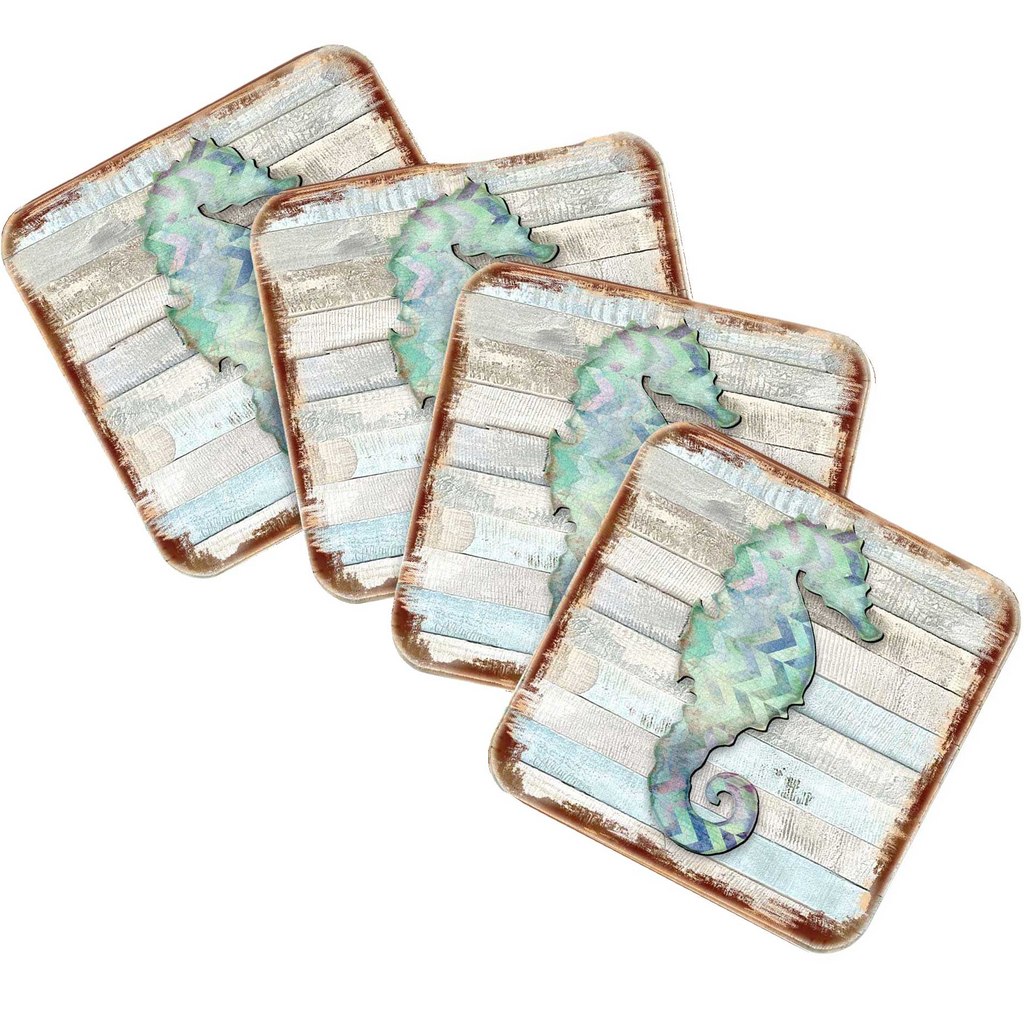 four square coasters with a seahorse design on them.