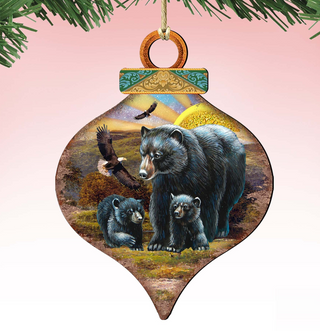 A decorative ornament featuring a mother bear and her cubs in a natural setting, with a bird flying overhead.