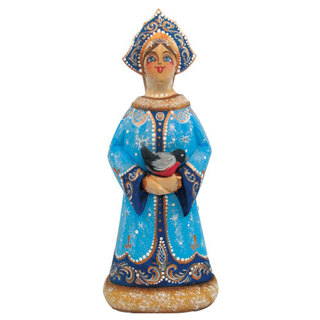 A figurine of a woman wearing a blue dress with gold accents and a blue headdress, holding a bird in her hands.
