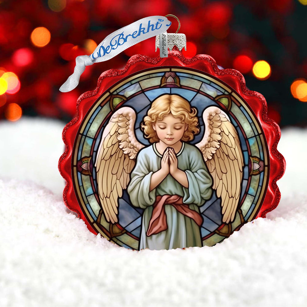 a stained glass ornament with an angel on it