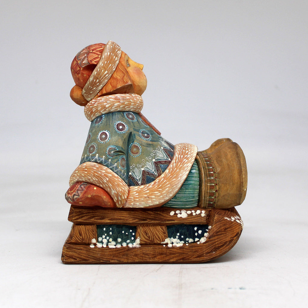 One-of-a-Kind Girl on Sleigh WOODCARVED Figurine 4.5x3.5x3 by G. Debrekht - Unique Handcrafted and Handpainted Collectible