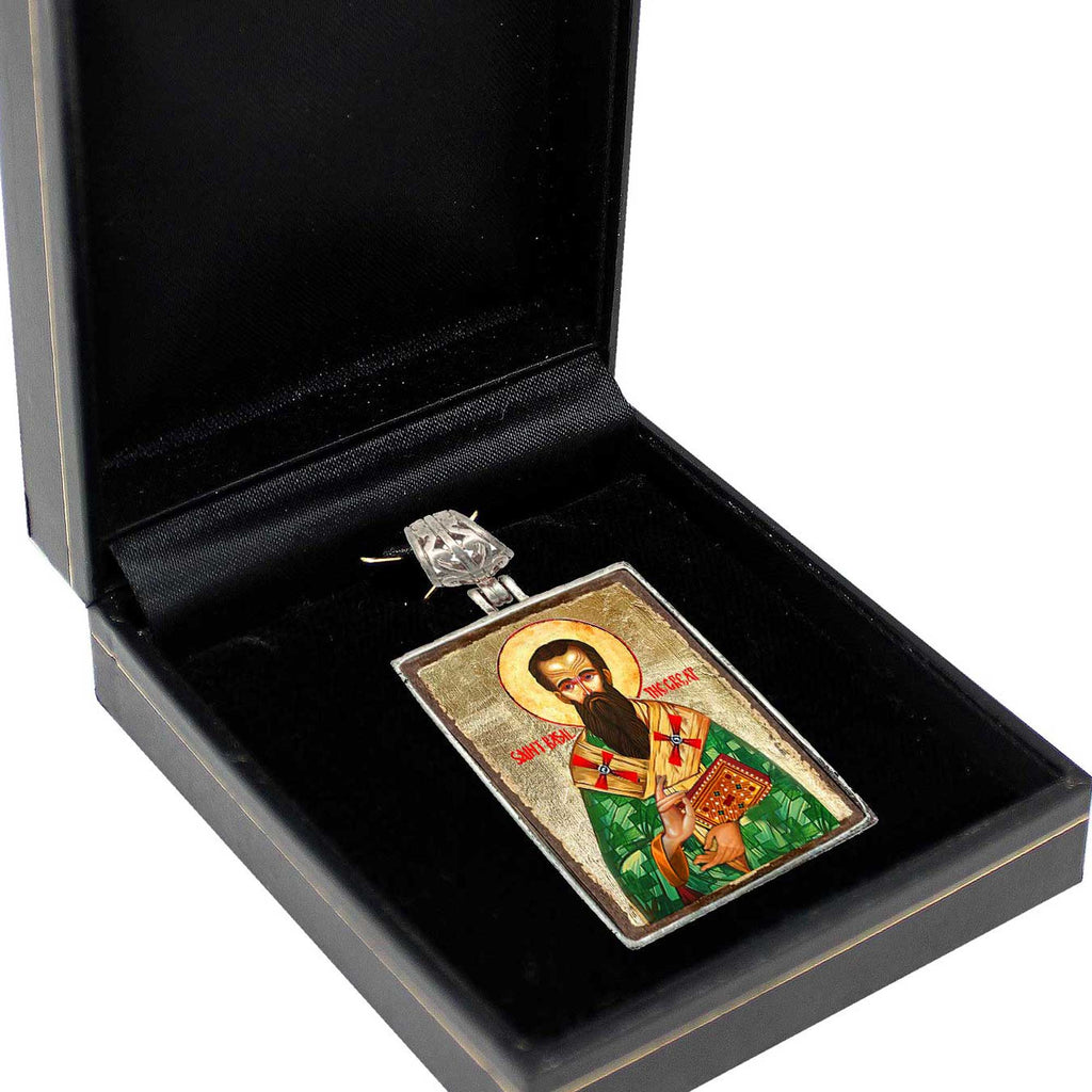 a religious icon or symbol, possibly a religious figure, displayed in a black box or case.