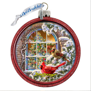 a christmas ornament with a cardinal and a cardinal bird