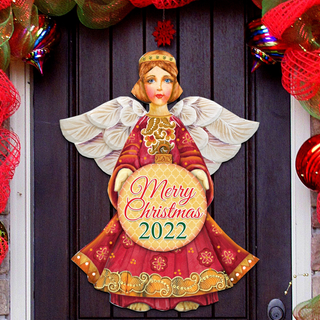 A Christmas-themed door decoration featuring a painted angel holding a