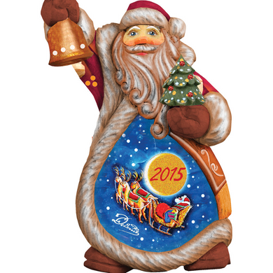 A wooden Santa Claus figurine holding a bell and a Christmas tree, with a blue background depicting a scene of Santa's sleigh and reindeer.