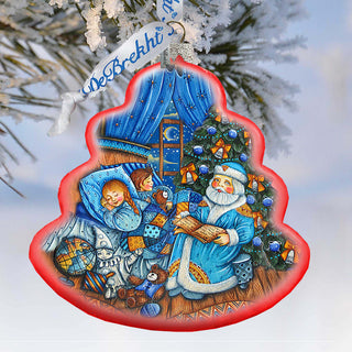 A Christmas ornament depicting Santa Claus reading a book to a sleeping child, surrounded by toys and a Christmas tree.