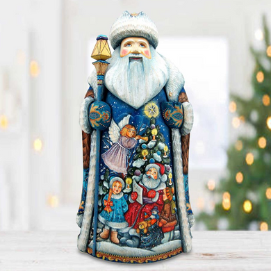 A detailed figurine of Santa Claus, adorned with various Christmas-themed decorations, is displayed on a wooden surface.