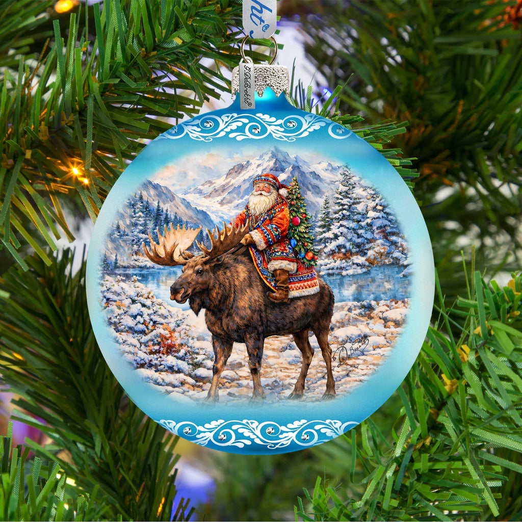 Santa Riding Moose Limited Edition Glass Christmas Ornament – Winter Wildlife Collectible by G. DeBrekht – 73981