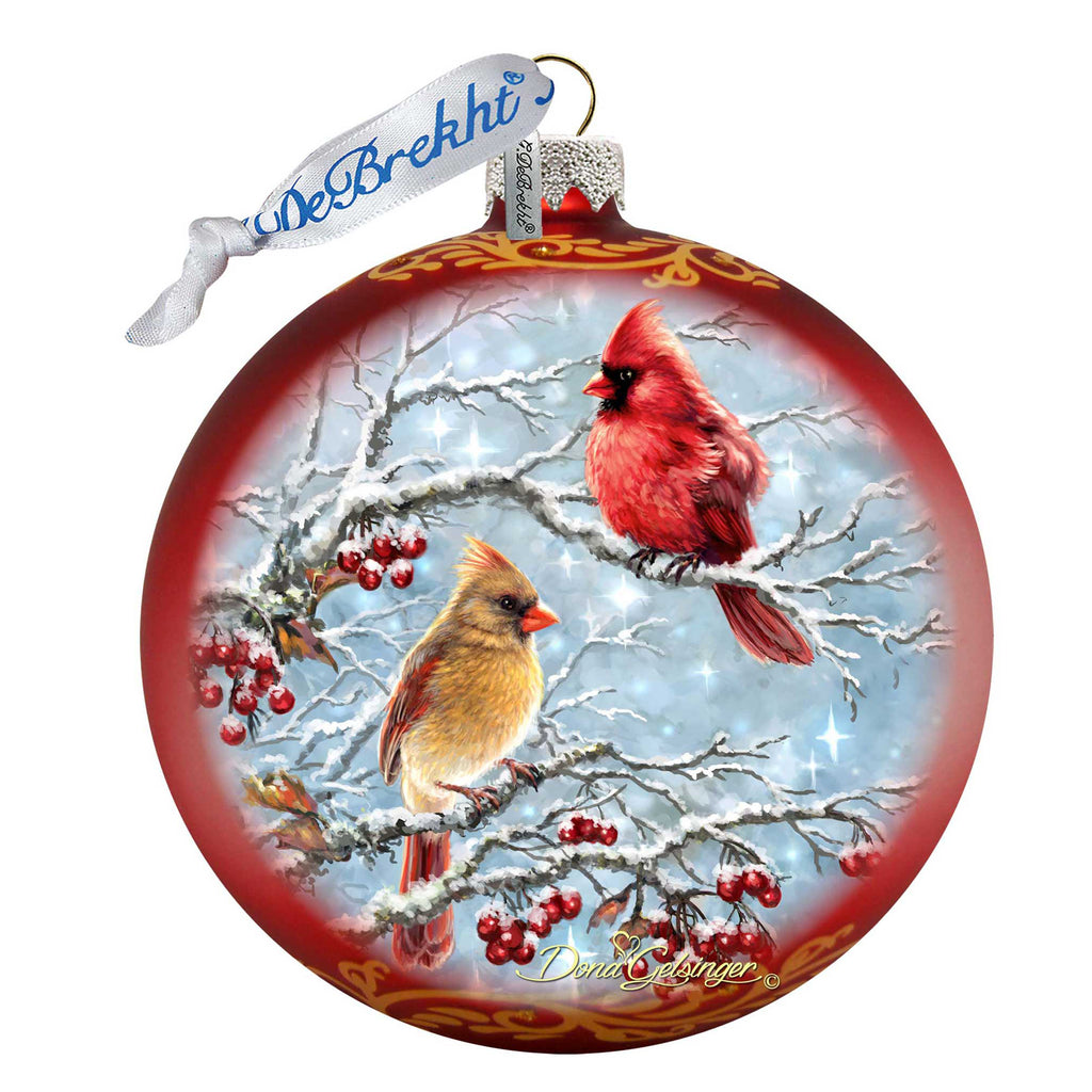 a christmas ornament with a cardinal and a cardinal on it