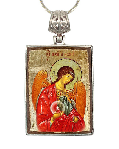 a religious icon of an angel wearing a red robe and holding a book.