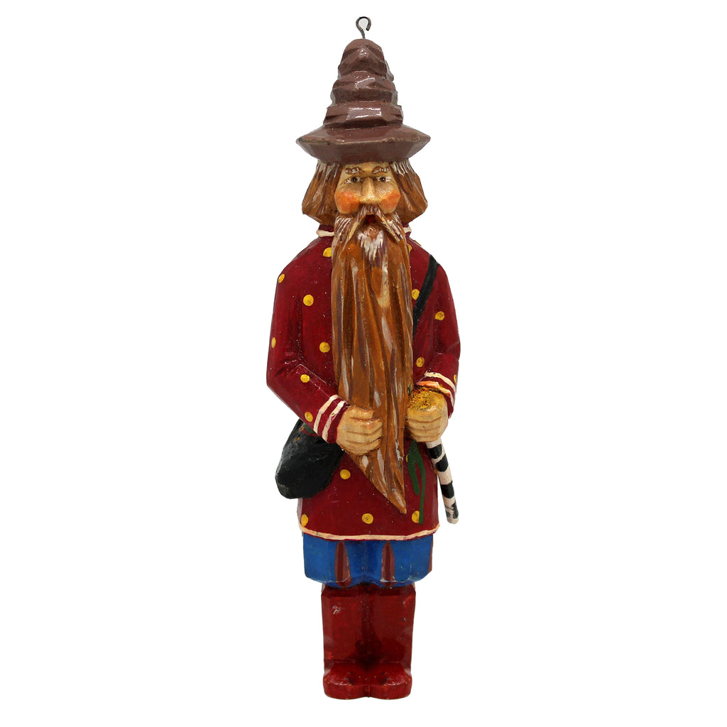A wooden ornament depicting a man with a long beard wearing a red coat and a brown hat.
