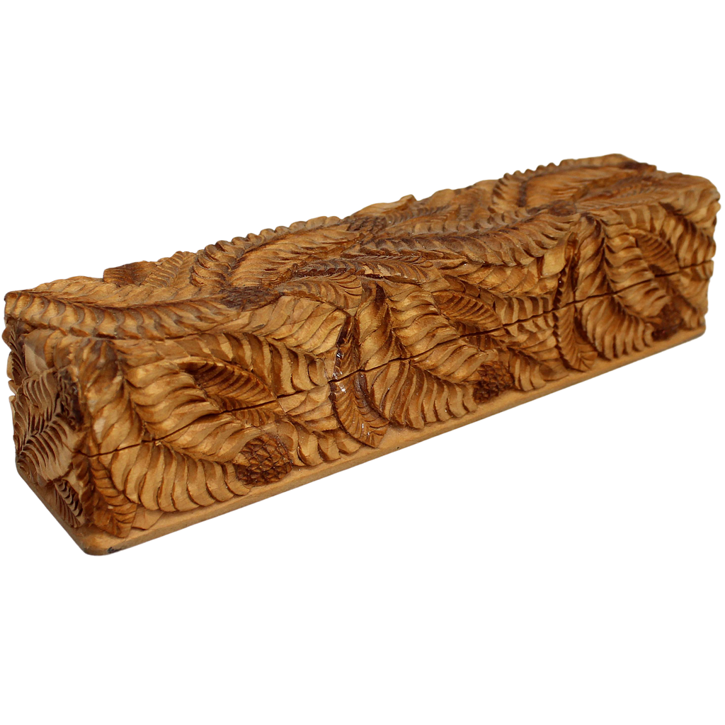 A wooden box with a carved design on its surface, featuring a repeating pattern of leaves or branches.