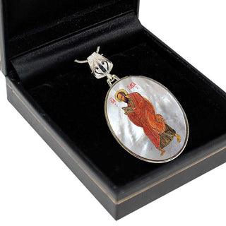 A pendant with a religious icon, possibly a saint or deity, is displayed in a black box.