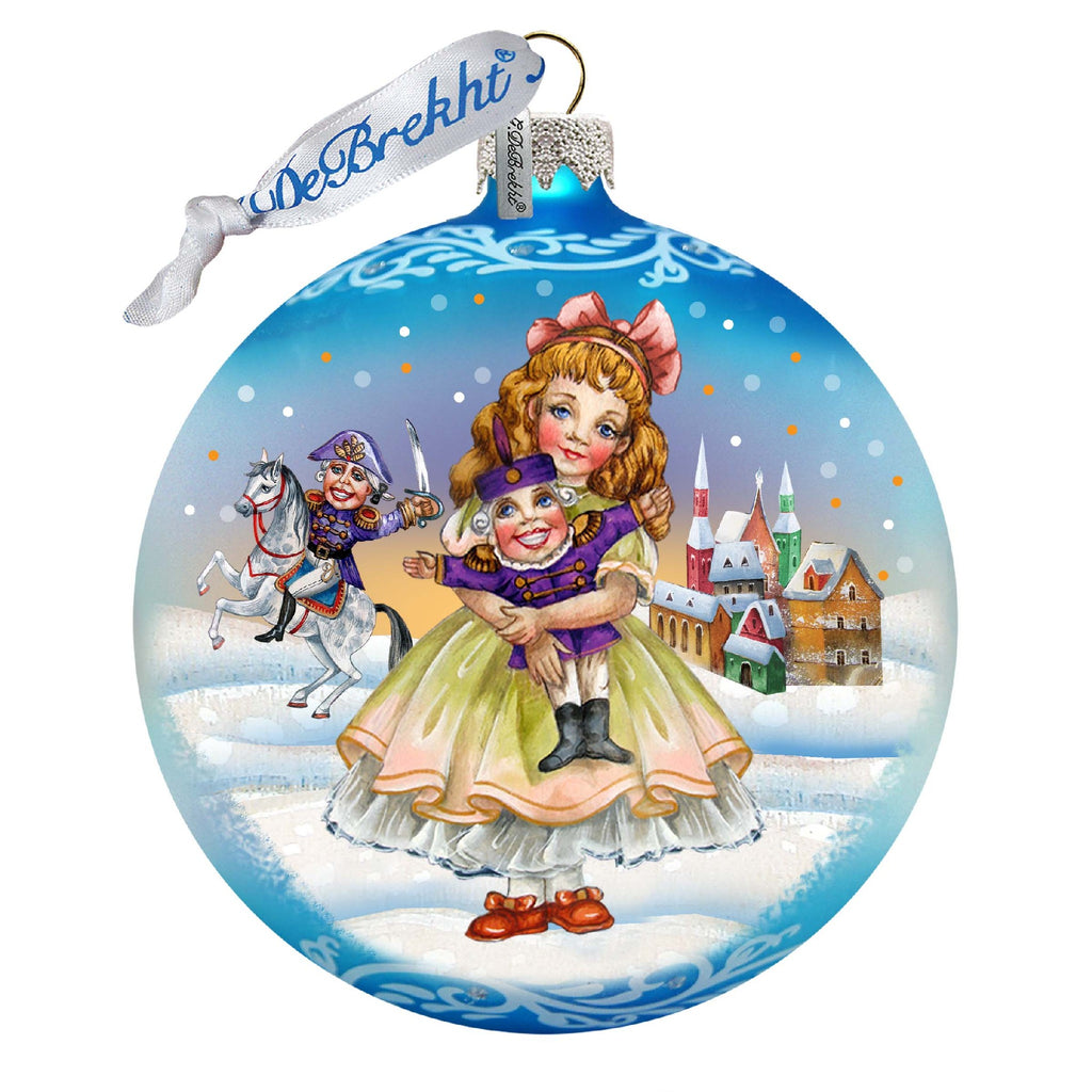 a glass ornament with a picture of a girl holding a cat