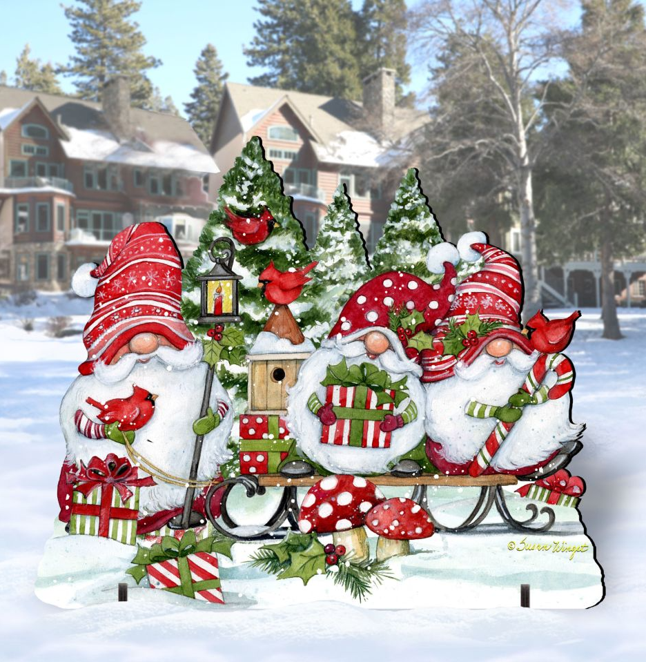 A festive Christmas scene featuring three gnomes in red and white hats, each holding a gift box, surrounded by a snowy landscape with trees and houses in the background.