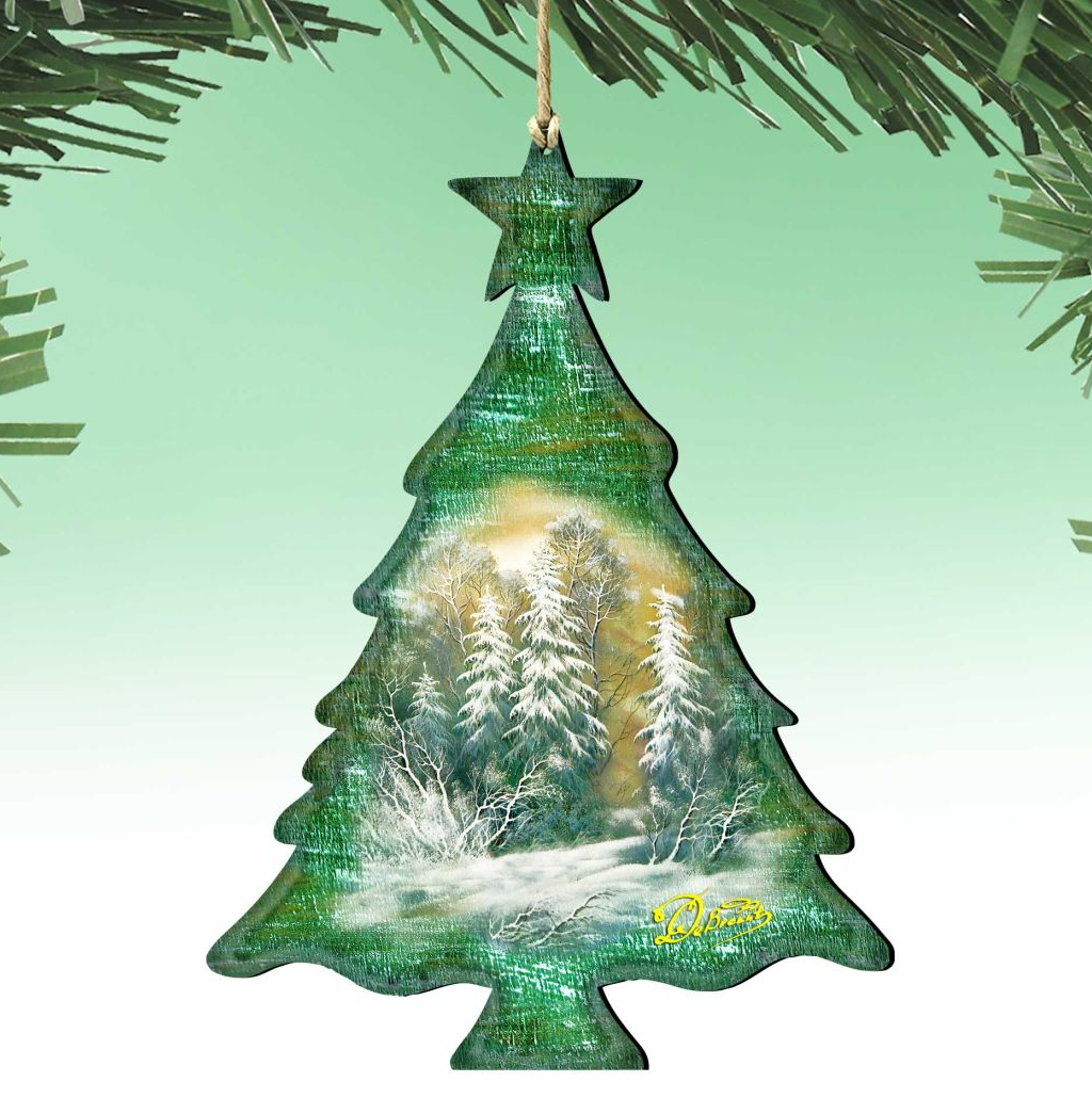 A Christmas tree ornament in the shape of a tree, with a snowy winter landscape depicted inside.