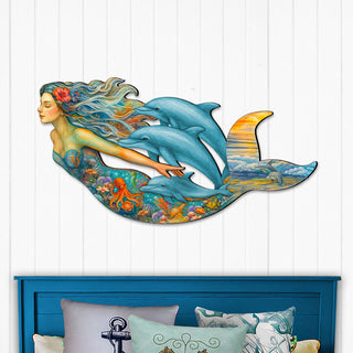 Handcrafted mermaid wall art with dolphins, coral reef, and ocean sunset, created by GDebrekht Artistic Studio. Features vibrant underwater details and flowing design, perfect for coastal wall decor, beach house accents, or ocean-themed gifts. Made in the USA, ideal for indoor display above couches or entryways. A unique piece of coastal holiday decor.