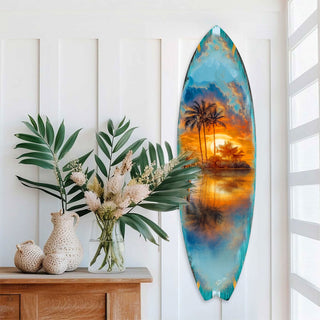 Handcrafted Tropical Sunset Surfboard Wall Art by G. DeBrekht, featuring a serene island scene with palm trees and a golden sunset reflected on tranquil waters. Perfect coastal wall decor for beach houses, surf-themed spaces, and nautical interiors. UV-coated for indoor & outdoor display.