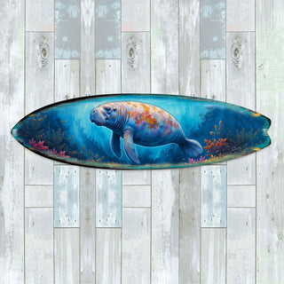 Handcrafted Manatee Surfboard Wall Art by G. DeBrekht, featuring a gentle manatee swimming through a vibrant underwater scene with coral and marine life. Perfect coastal wall decor for beach houses, ocean lovers, and nautical interiors. UV-coated for indoor & outdoor display.