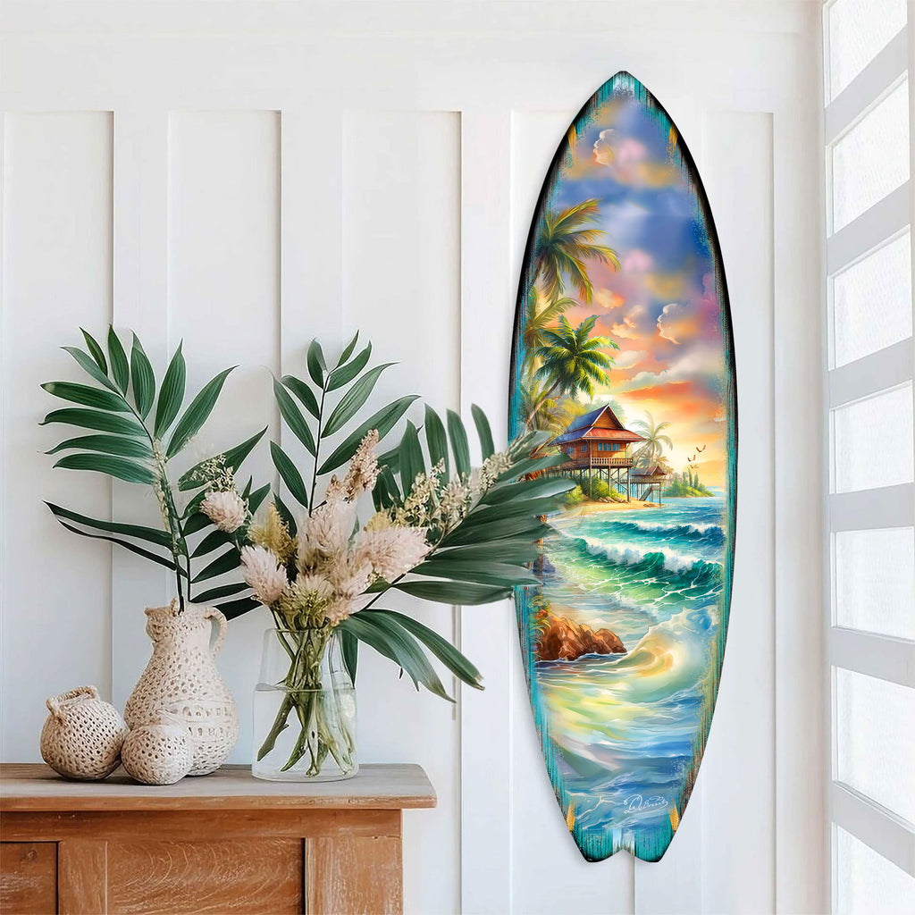 Handcrafted Tropical Beach House Surfboard Wall Art by G. DeBrekht, featuring a vibrant oceanfront bungalow, palm trees, and rolling waves. Perfect coastal wall decor for beach house interiors, surf-inspired spaces, and nautical-themed rooms. UV-coated for indoor & outdoor display.