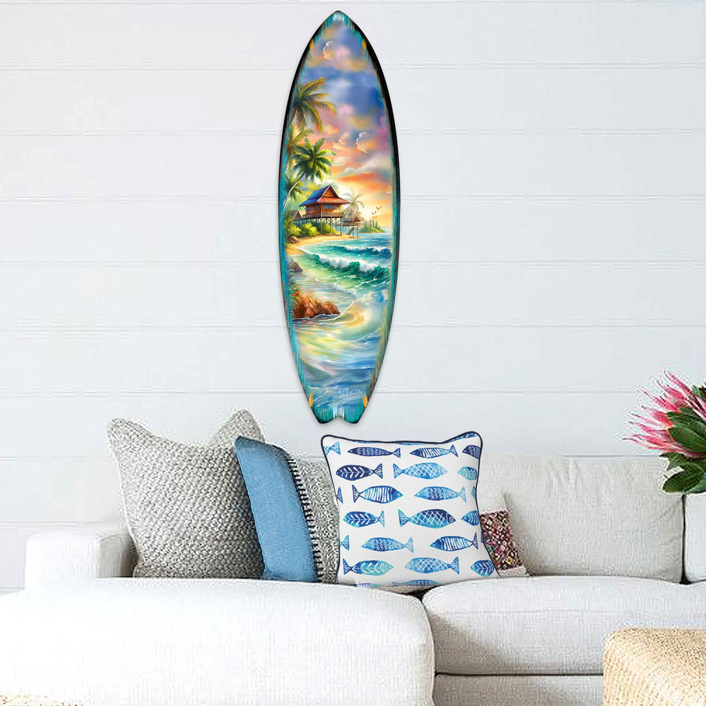Handcrafted Tropical Beach House Surfboard Wall Art by G. DeBrekht, featuring a vibrant oceanfront bungalow, palm trees, and rolling waves. Perfect coastal wall decor for beach house interiors, surf-inspired spaces, and nautical-themed rooms. UV-coated for indoor & outdoor display.
