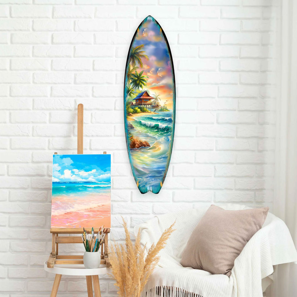 Handcrafted Tropical Beach House Surfboard Wall Art by G. DeBrekht, featuring a vibrant oceanfront bungalow, palm trees, and rolling waves. Perfect coastal wall decor for beach house interiors, surf-inspired spaces, and nautical-themed rooms. UV-coated for indoor & outdoor display.