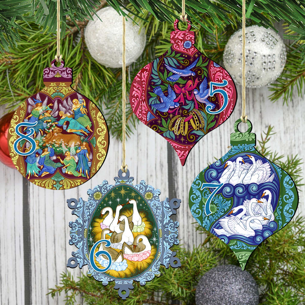 a collection of colorful and intricately designed Christmas ornaments hanging on a tree branch.