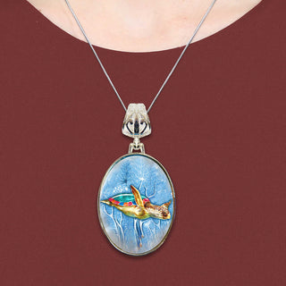A necklace with a pendant featuring a colorful painting of a turtle swimming in the ocean.