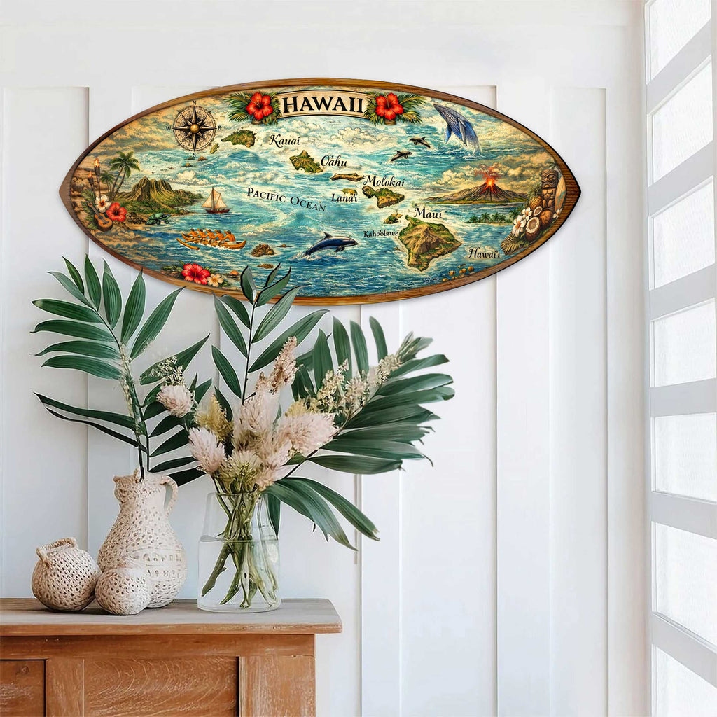 a decorative wooden surfboard with a colorful map of Hawaii, hanging on a wall above a wooden table with a vase of flowers and a potted plant.