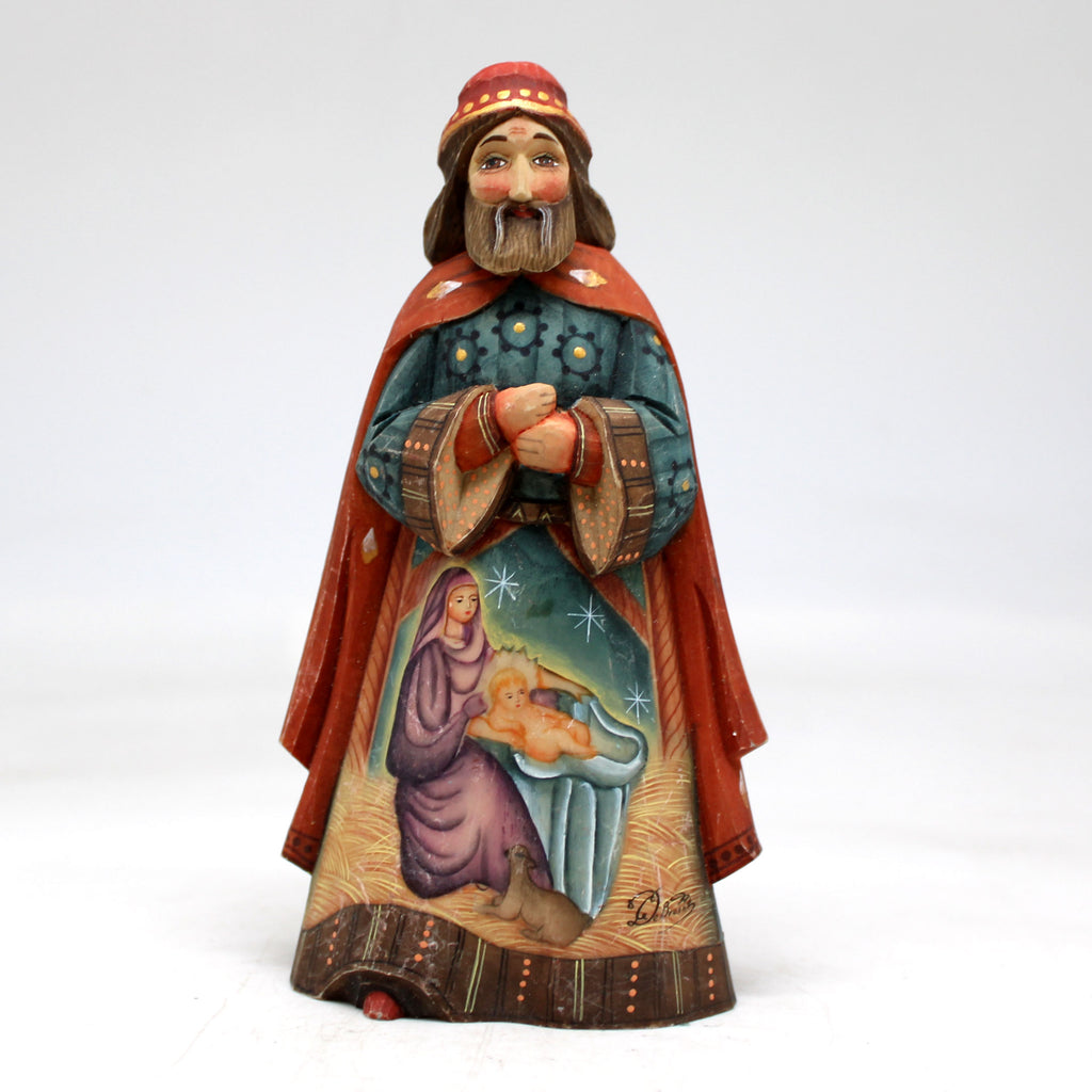 a figurine of a man with a cat