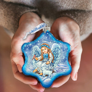 a person holding an ornament in their hands
