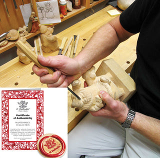 a man is carving a wooden object in a shop