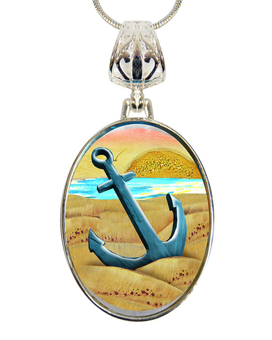 A pendant necklace with a circular design featuring a blue anchor and a sunset landscape.