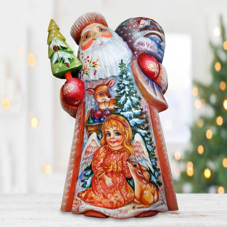 A colorful, hand-painted Christmas ornament depicting Santa Claus, a reindeer, a girl, and a bird, all set against a snowy winter landscape.