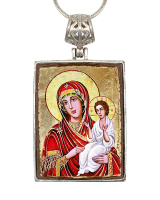 a religious icon featuring the Virgin Mary holding the baby Jesus.