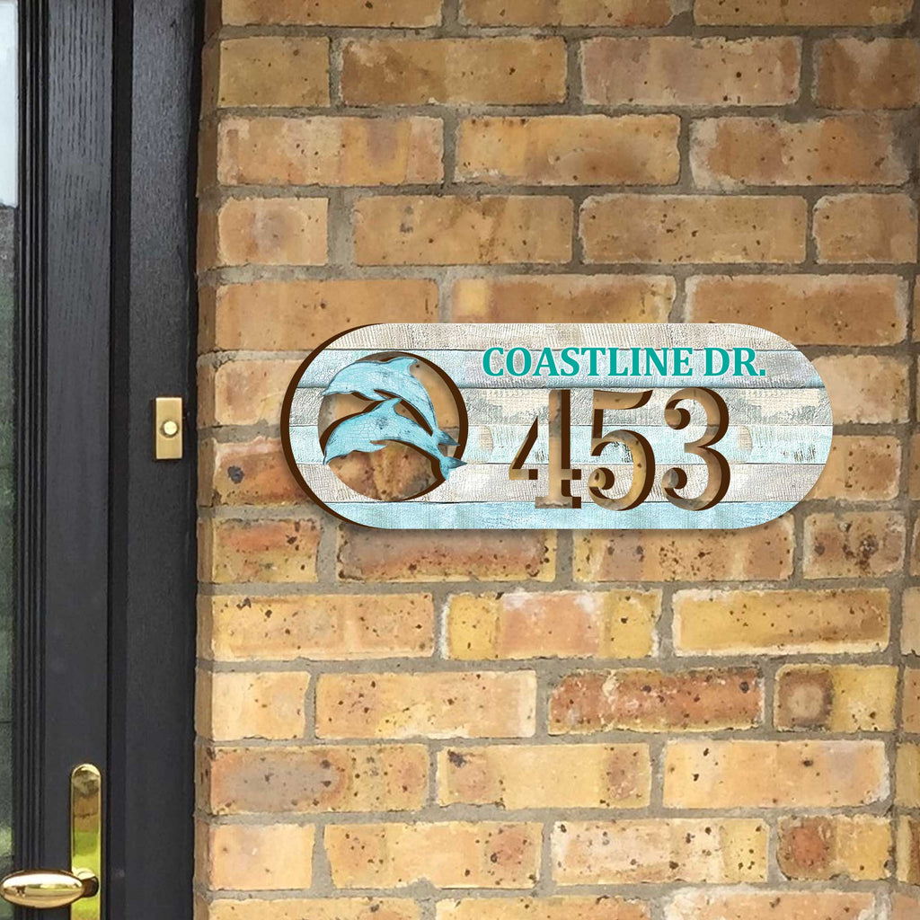 Oval coastal address plaque featuring dolphin cutout, house number 453, and customizable COASTLINE DR. street name, handcrafted by GDebrekht Artistic Studio. Perfect for nautical house numbers, coastal door decoration, beach house decor, and outdoor holiday decorations.