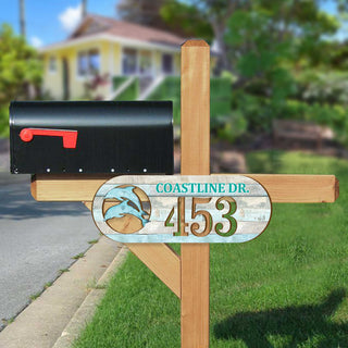Oval coastal address plaque featuring dolphin cutout, house number 453, and customizable COASTLINE DR. street name, handcrafted by GDebrekht Artistic Studio. Perfect for nautical house numbers, coastal door decoration, beach house decor, and outdoor holiday decorations.