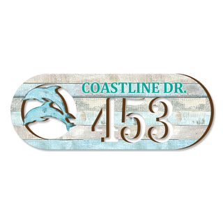 Oval coastal address plaque featuring dolphin cutout, house number 453, and customizable COASTLINE DR. street name, handcrafted by GDebrekht Artistic Studio. Perfect for nautical house numbers, coastal door decoration, beach house decor, and outdoor holiday decorations.