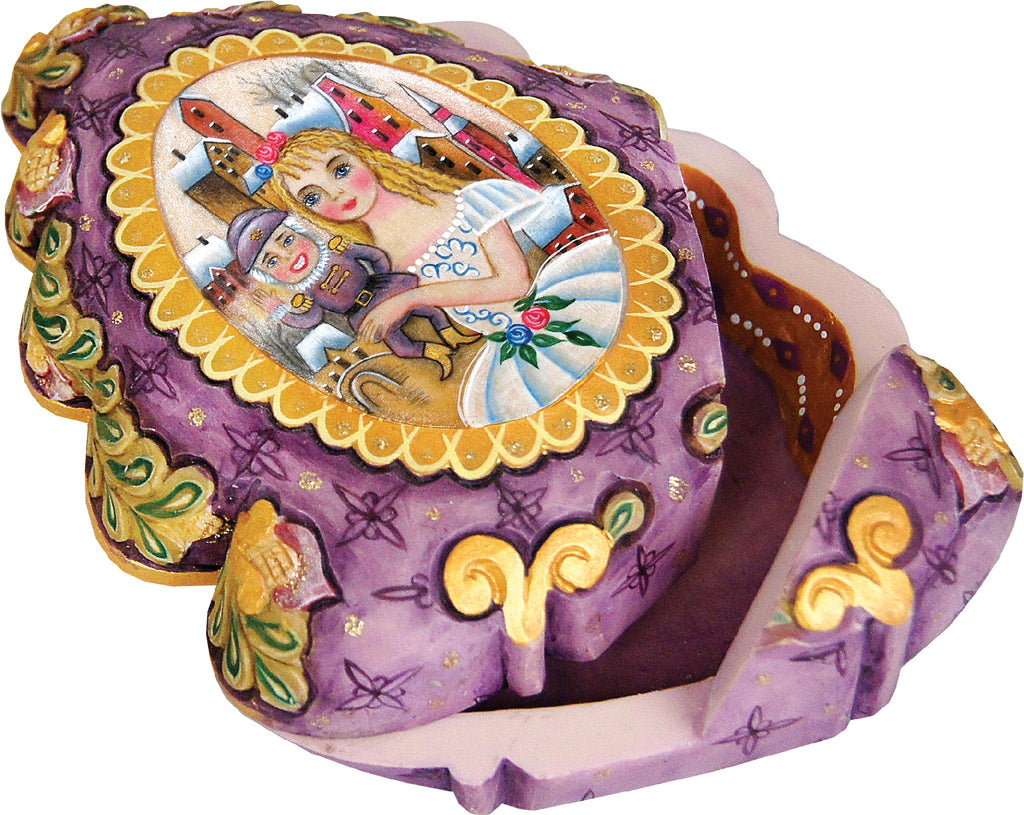 a purple and gold box with a painted scene of a girl and a nutcracker.