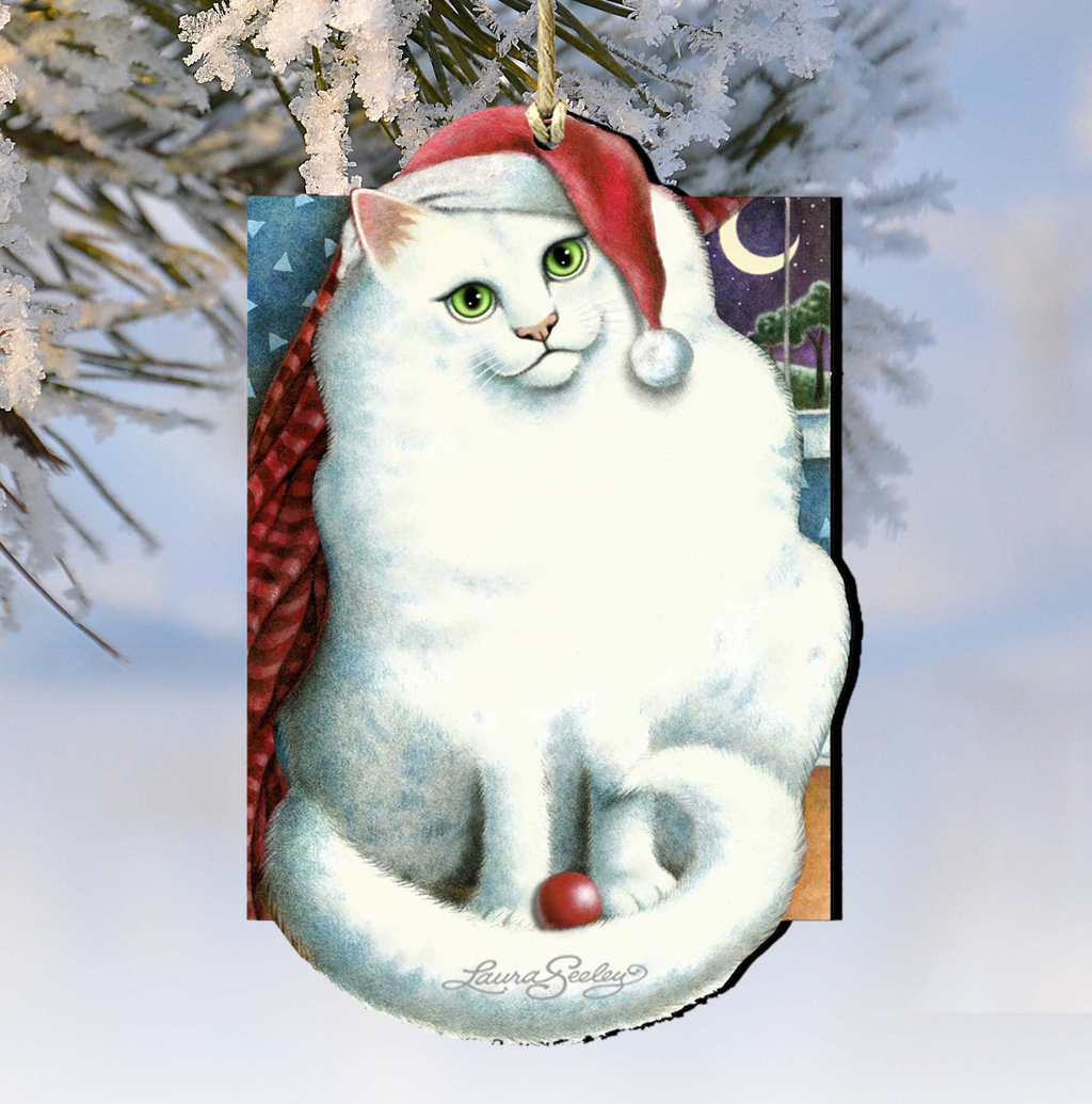 A white cat wearing a red Santa hat is sitting on a snowy branch, with a snowy landscape and a crescent moon in the background.