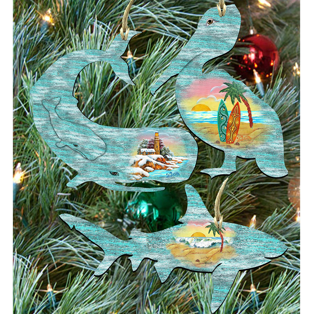 A Christmas tree decorated with various ornaments, including a large blue whale, a palm tree, and a surfer.
