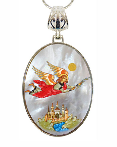 a pendant with a detailed illustration of a winged figure, possibly an angel, flying above a castle or palace.