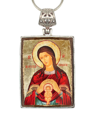 a religious icon of the Virgin Mary, with a halo around her head and holding a baby.