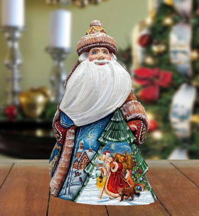 A colorful, hand-painted Santa Claus figurine with a white beard and hat, standing on a wooden surface.