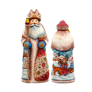 two intricately carved wooden figurines, depicting Santa Claus and a young girl, set against a white background.
