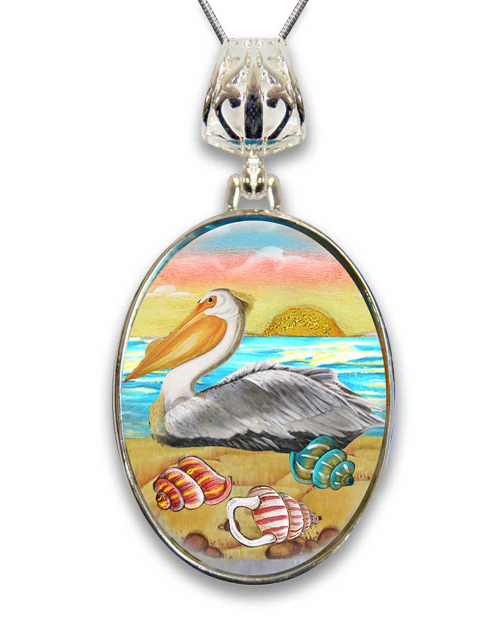 A pendant necklace with a circular design featuring a pelican, a sunset, and various seashells.