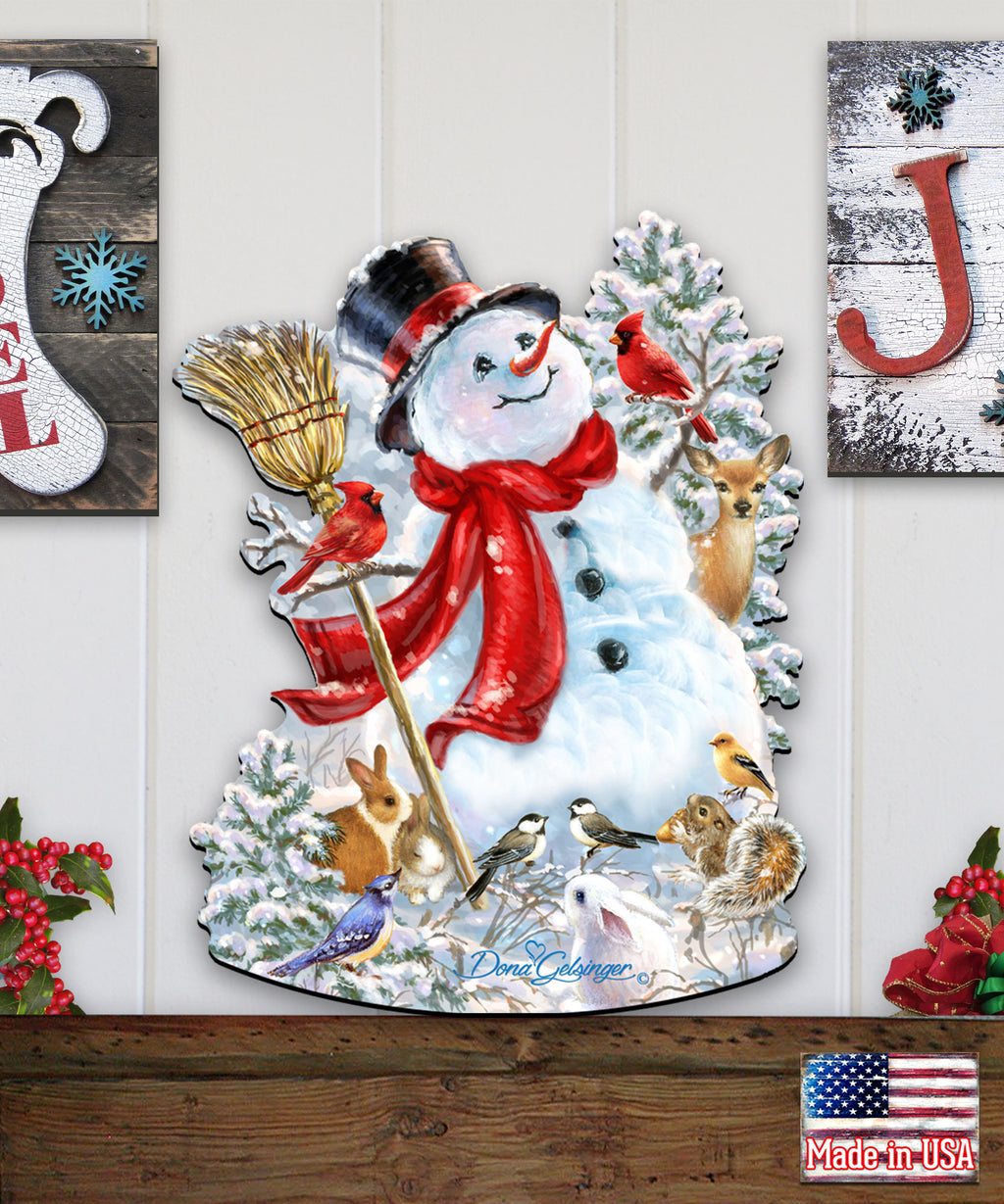 A snowman decoration with various animals, including a bird, a rabbit, and a squirrel, surrounding it. The snowman is wearing a red scarf and a top hat.