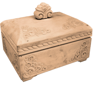 a wooden box with intricate carvings and a decorative top.