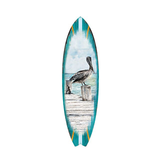 A surfboard with a painted image of a pelican standing on a wooden dock.
